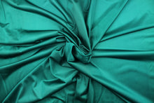 Load image into Gallery viewer, This sheer fabric features a design in a teal green .
