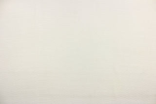 This sheer fabric features a design in a off white. 