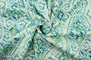  This fabric features an Aztec design in turquoise, lime green and white. 