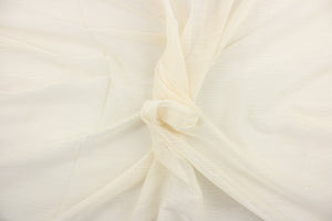 This sheer fabric features a design in a off white. 