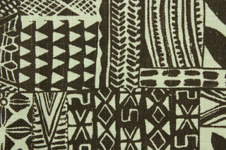  This fabric features a tribal design in brown and natural. 