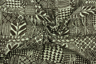  This fabric features a tribal design in brown and natural. 