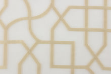 Load image into Gallery viewer, This sheer fabric features a geometric design in gold against white.
