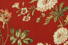 Load image into Gallery viewer, This fabric features a floral design in green, beige, coral, and white set against a red background. 
