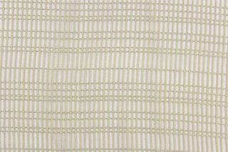 This sheer fabric features a design in beige  .