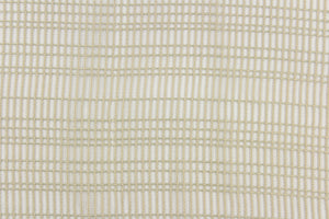 This sheer fabric features a design in beige  .