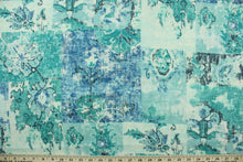 Load image into Gallery viewer, This fabric features a abstract design in blue, turquoise, gray, and teal.
