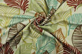 This fabric features a botanical leaf design in brown, turquoise, brunt orange, olive green, and yellow set against a beige background.