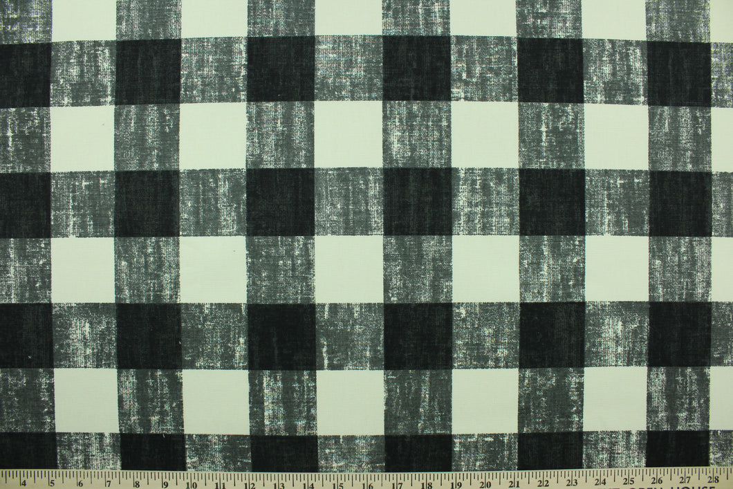This fabric features a buffalo plaid design in gray, black and dull white.