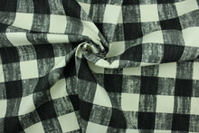 Load image into Gallery viewer, This fabric features a buffalo plaid design in gray, black and dull white.
