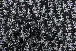 This fabric features white bamboo plants in white on a black background. It has a nice soft hand and would be great for quilting, crafting and home decor.  