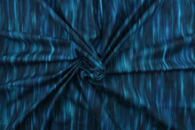 Load image into Gallery viewer, This fabric in shades of blue and teal with accents of black blend together to create a beautiful color palette.  It has a nice soft hand and would be great for  quilting, crafting and home decor.  
