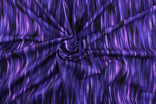 This fabric features stripes in varying shades of purple and violet with accents of black blend together to create a beautiful color palette.  It has a nice soft hand and would be great for quilting, crafting and home decor.  We offer this pattern in several different shades.