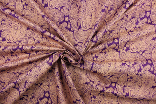 This fabric features paisley design in peach against a light violet background.  It has a nice soft hand and would be great for quilting, crafting and home decor.  We offer this fabric in several different colors.