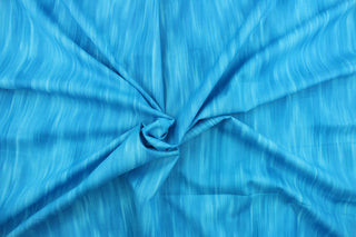 This fabric features stripes in varying shades of turquoise and blue that blend together to create a beautiful color palette.  It has a nice soft hand and would be great for quilting, crafting and home decor.  We offer this pattern in several different colors.