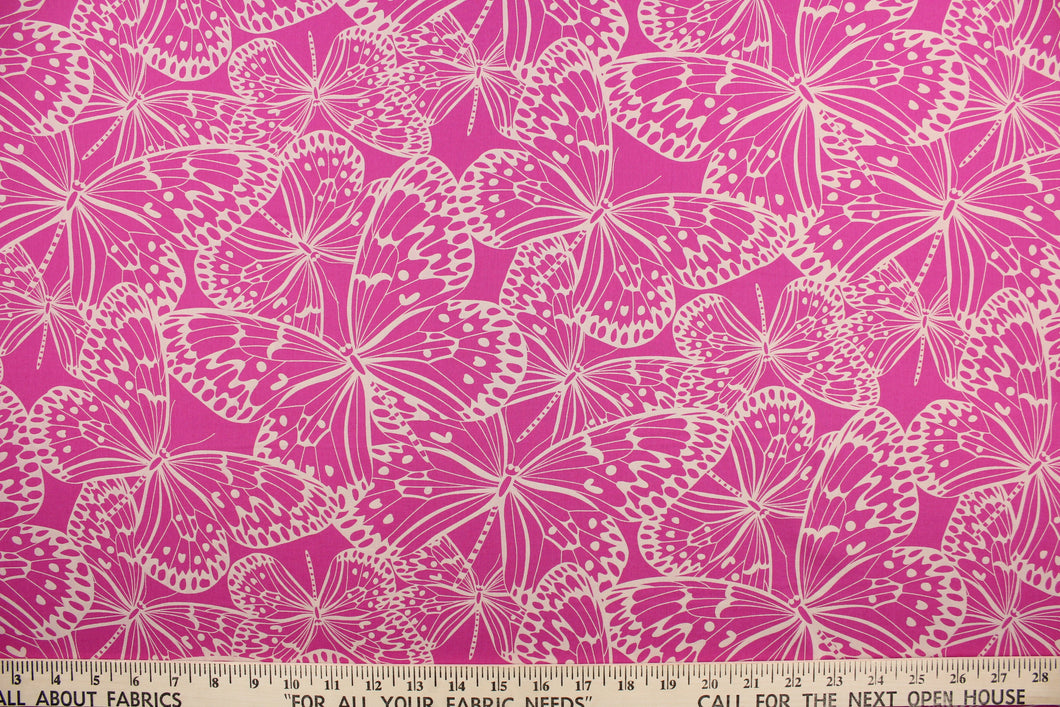 This fabric features butterflies in beige on a dark pink background.  It has a nice soft hand and would be great for quilting, crafting and home decor.  