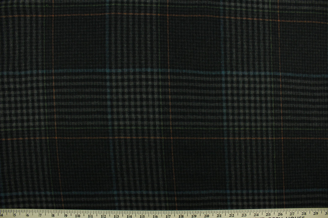 This multi use wool features a plaid design in ebony black, gray, blue and orange and is great for cooler weather.  It has a great hand and is hard-wearing.  The durability and wrinkle resistance makes it perfect for suits, jackets, overcoats, dresses, drapery and upholstery projects.