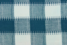 Load image into Gallery viewer, This fabric features a plaid design in teal and white.  It has a nice soft hand and would be great for quilting, crafting and home decor.  We offer this fabric in several different colors.
