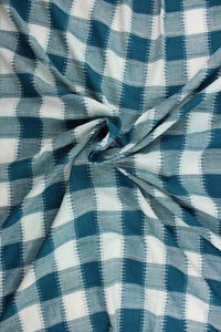 This fabric features a plaid design in teal and white.  It has a nice soft hand and would be great for quilting, crafting and home decor.  We offer this fabric in several different colors.