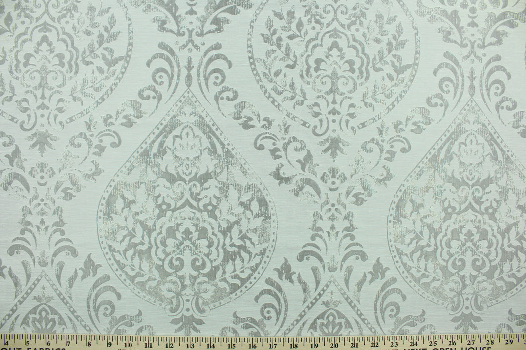 Cynthia features a distressed damask pattern in silver.  It is durable and hard wearing and would be great for multi-purpose upholstery, bedding, accent pillows and drapery.  We offer this pattern in one other color.