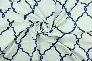 Lariat is an embroidered fabric that features an embossed trellis design in in navy blue and white.  Uses include light upholstery, pillows, bedding and window treatments.  