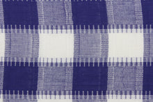 Load image into Gallery viewer, This fabric features a plaid design in purple and white.  It has a nice soft hand and would be great for quilting, crafting and home decor.  We offer this fabric in several different colors.
