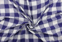 Load image into Gallery viewer, This fabric features a plaid design in purple and white.  It has a nice soft hand and would be great for quilting, crafting and home decor.  We offer this fabric in several different colors.
