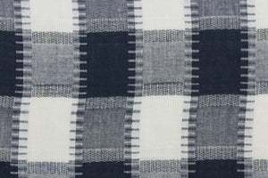This fabric features a plaid design in dark blue, grey and white.  It has a nice soft hand and would be great for quilting, crafting and home decor.  We offer this fabric in several different colors.