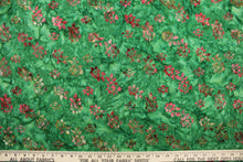 Load image into Gallery viewer, This fabric features small flowers in red, light pink, dark green, brown and light purple on a green background.  It has a nice soft hand and would be great for quilting, crafting and home decor.  

