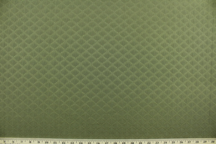 Concentric is a multi use, textured jacquard featuring a diamond design in sage green.  It is great for home décor such as upholstery, window treatments, pillows, duvet covers, tote bags and more.  It has a soft workable feel yet is stable and durable.  