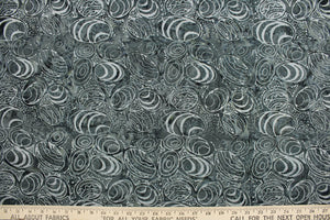  This fabric features seashells in shades of gray.  It has a nice soft hand and would be great for quilting, crafting and home decor.  We offer this fabric in one other color.