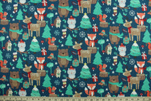 Load image into Gallery viewer, This fun Christmas print features forest animals with trees, presents, stockings and snowflakes.  Colors included are red, white, green, grey, beige, brown, orange and yellow.  It has a nice soft hand and would be great for quilting, crafting and home décor.  

