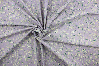 This fabric features a leaf and stem design in dark green and cream on a light purple background.  It has a nice soft hand and would be great for quilting, crafting and home decor.  We offer this fabric in several other colors.