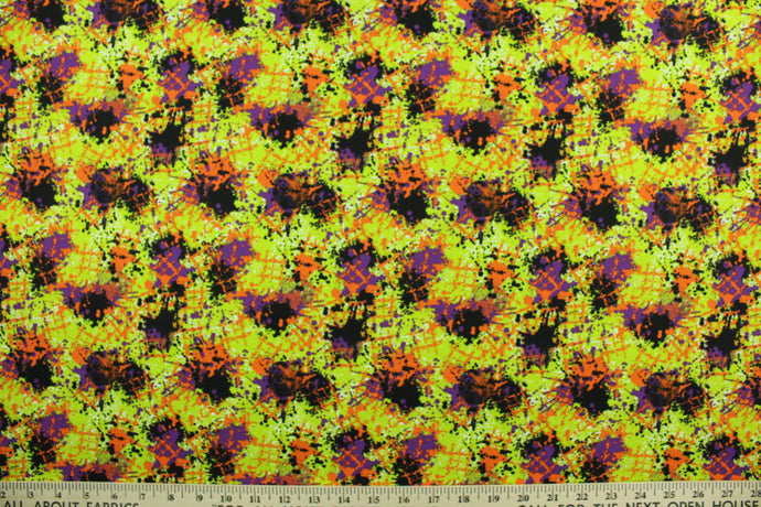 This fabric features a splatter design in Halloween colors of orange, purple, black, white and purple on a lime green background.  It has a nice soft hand and would be great for quilting, crafting and home decor.  