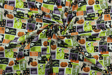 Load image into Gallery viewer, This cotton print fabric features a Halloween themed patchwork design of skeletons, bats, ghosts, mummies, Frankenstein and pumpkins.  It has a nice soft hand and would be great for quilting, crafting and home decor.  
