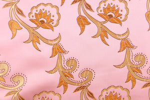 Elegant portrays this jacquard fabric which features intricate woven flowers in gold on a pink background.  Made of 100% polyester this fabric is durable, strong, and wrinkle resistant and has a luxurious feel.  This fabric would compliment any room whether you use it for drapery or throw pillows.  It is also perfect for upholstery, home décor, duvet covers and apparel. The possibilities are endless.  