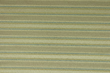 Load image into Gallery viewer, This rich woven yarn dyed fabric features a striped design in heather blue and champagne.  Enhancing the color and texture of the stripes is a slight sheen.  Heavy weight and woven stripes make the 100% polyester fabric durable, strong and fade resistant.  This fabric would enrich any room whether you use it for light upholstery, throw pillows, drapery and home décor.
