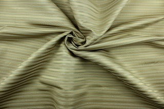 This rich woven yarn dyed fabric features a striped design in heather blue and champagne.  Enhancing the color and texture of the stripes is a slight sheen.  Heavy weight and woven stripes make the 100% polyester fabric durable, strong and fade resistant.  This fabric would enrich any room whether you use it for light upholstery, throw pillows, drapery and home décor.