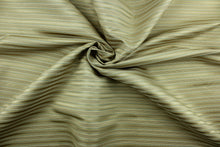 Load image into Gallery viewer, This rich woven yarn dyed fabric features a striped design in heather blue and champagne.  Enhancing the color and texture of the stripes is a slight sheen.  Heavy weight and woven stripes make the 100% polyester fabric durable, strong and fade resistant.  This fabric would enrich any room whether you use it for light upholstery, throw pillows, drapery and home décor.
