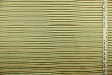 Load image into Gallery viewer, This rich woven yarn dyed fabric features a striped design in green, russet and golden beige.  Enhancing the color and texture of the stripes is a slight sheen.  Heavy weight and woven stripes make the 100% polyester fabric durable, strong and fade resistant.  This fabric would enrich any room whether you use it for light upholstery, throw pillows, drapery and home décor.
