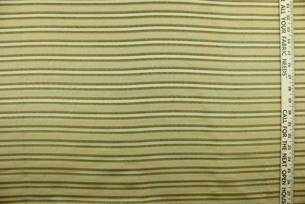 This rich woven yarn dyed fabric features a striped design in green, russet and golden beige.  Enhancing the color and texture of the stripes is a slight sheen.  Heavy weight and woven stripes make the 100% polyester fabric durable, strong and fade resistant.  This fabric would enrich any room whether you use it for light upholstery, throw pillows, drapery and home décor.