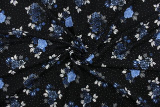This fabric features roses in blue and black tones on a black background with white polka dots.  It is durable and breathable and will allow movements of the body.  Uses include dance and sports wear, leotards and dresses.  We offer several different lycra fabrics.   