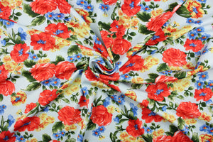 This fabric features a floral design in red, blue and yellow on a light blue background.  It is durable and breathable and will allow movements of the body.  Uses include dance and sports wear, leotards and dresses.  We offer several different lycra fabrics.   