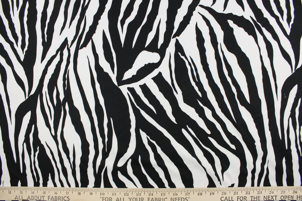 This fun fabric features a zebra print in black and white.  It has a nice soft hand and would be great for quilting, crafting, apparel and home decor.  The possibilities are endless.