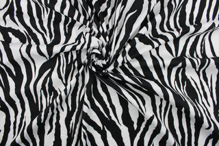 This fun fabric features a zebra print in black and white.  It has a nice soft hand and would be great for quilting, crafting, apparel and home decor.  The possibilities are endless.