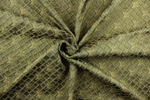  Linear is a textured fabric featuring diamonds and flowers in latte brown, beige and dark green and it has a slight sheen that enhances the design.  It is durable and hard wearing and would be great for light upholstery, bedding, accent pillows and drapery.  