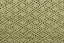 Load image into Gallery viewer, This fabric features a diamond design in toffee, olive green and peach and has a slight sheen that enhances the design.  It is durable and hard wearing and would be great for multi-purpose upholstery, bedding, accent pillows and drapery. 
