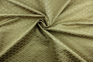 This fabric features a diamond design in toffee, olive green and peach and has a slight sheen that enhances the design.  It is durable and hard wearing and would be great for multi-purpose upholstery, bedding, accent pillows and drapery. 