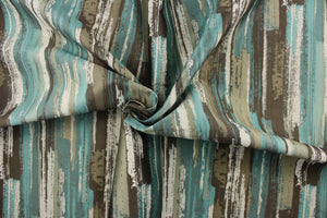  Westmore is a cotton blend fabric that features a unique design in shades of turquoise and brown on a light beige background.  This fabric would compliment any room whether you use it for drapery or throw pillows.  It is also perfect for upholstery, home décor, duvet covers and apparel. 