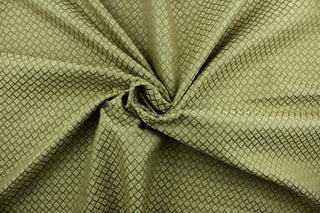  Coordinated is a multi use fabric featuring a diamond pattern in beige and green.  It is durable and hard wearing and would be great for multi-purpose upholstery, bedding, accent pillows and drapery.  